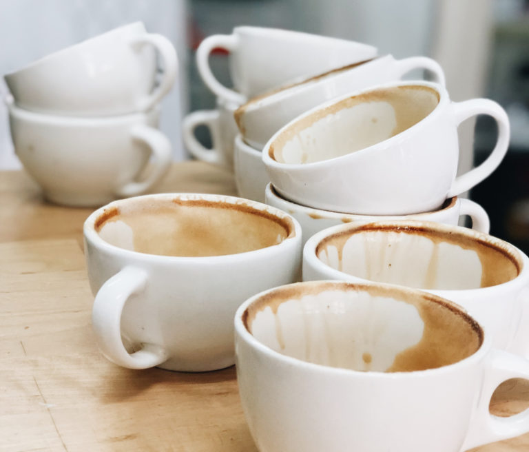 Pile of dirty coffee cups