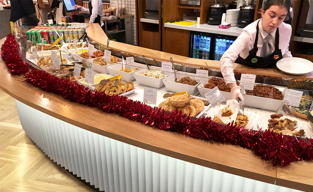 Front deli counter with bespoke caldding and wood counter top for Fallon and Byrne