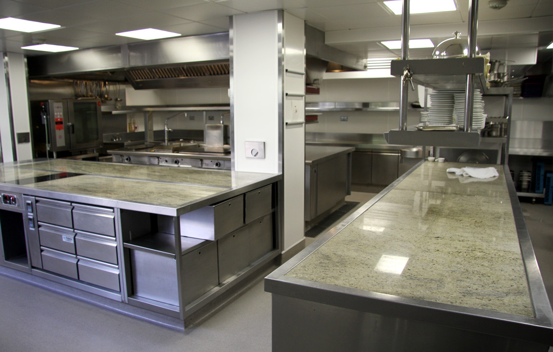 Kicthen with stainless steel and stone counter tops